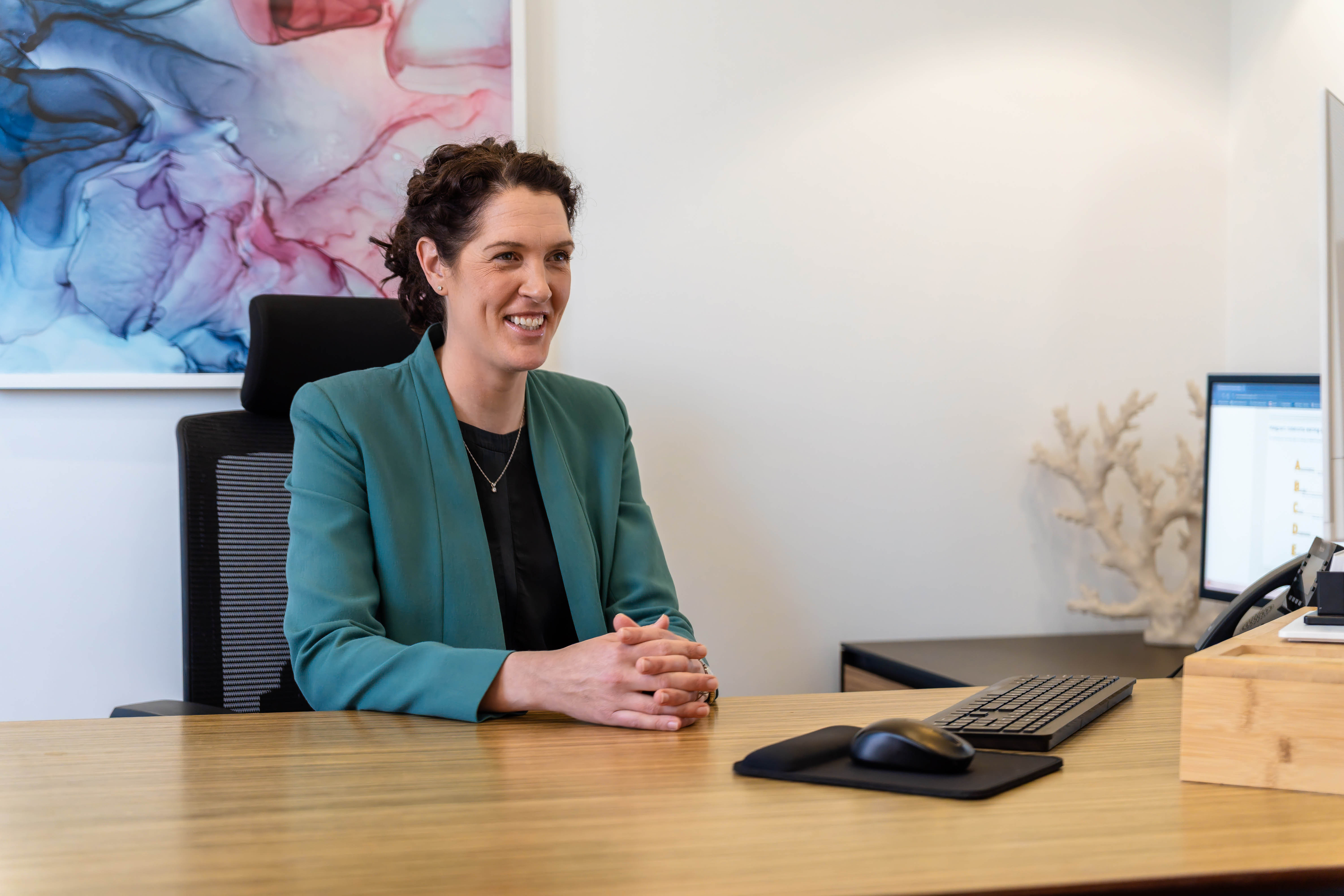 Dr Eliza Malkoun smiling during a consultation